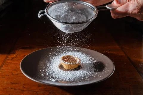 Sprinkle with powdered sugar Stock Photos