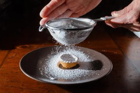 Sprinkle with powdered sugar Stock Photos