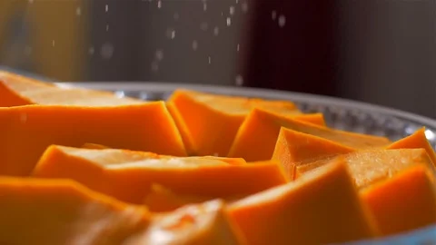 Sprinkle a pumpkin with powdered sugar before it is baked. Slow motion 動画素材 105878257