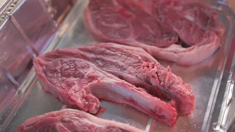 Sprinkle of salk onto lamb steak, slow motion Stock Footage 87894245