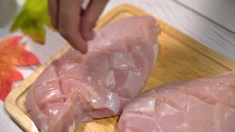 Sprinkle Salt on Chicken Stock Footage 243469523