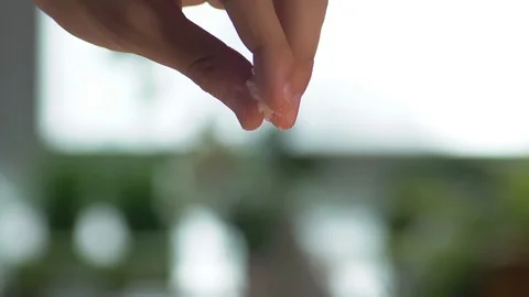 Sprinkle the salt, close up hand scene, prepare for cooking Video stock 96996433