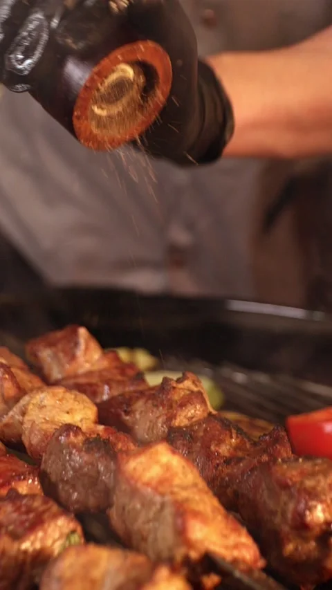 Sprinkle the shish kebab with pepper Stock Footage 219015326