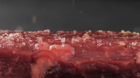 Sprinkle steak with a salt Stock Footage 113455388