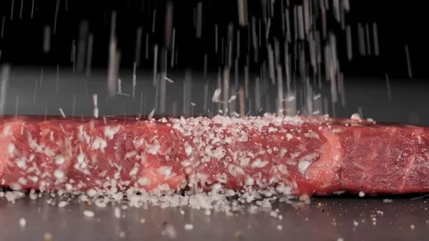 Sprinkle steak with a salt Stock-Footage 113455435