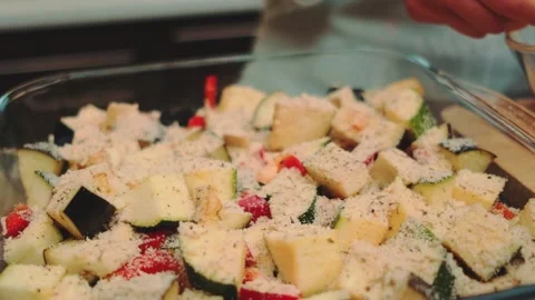 Sprinkle the vegetables with a mixture of Parmesan, salt and fresh garlic Stock Footage 252183618