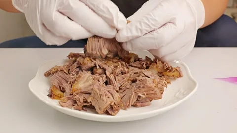 Sprinkle white pepper powder over beef in bowl. Stock Footage 343604539