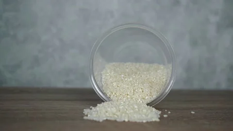 Sprinkled raw rice close up Video stock 145983832