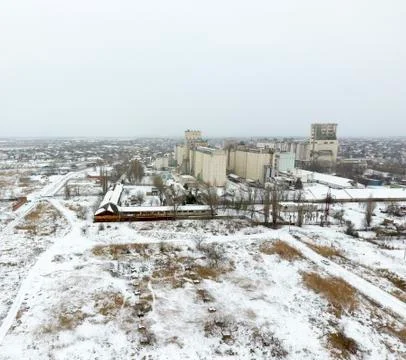 Sprinkled with snow grain elevator. Winter view of the old Soviet elevator. W Stock Photos