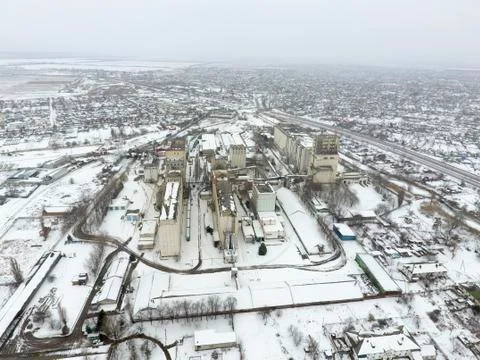 Sprinkled with snow grain elevator. Winter view of the old Soviet elevator. W Stock Photos
