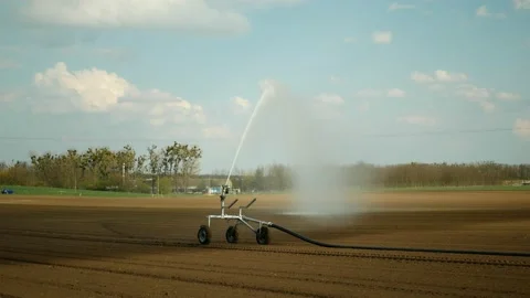 Sprinkler fields irrigation robot automatic watering water pipe cultivated Stock Footage 193217812
