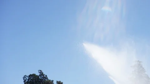 Sprinkler or irrigation system spraying water watering crop B Stock Footage 124328852