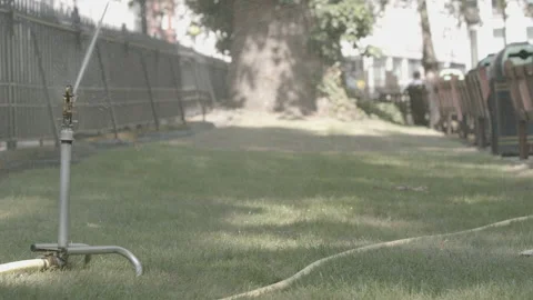 Sprinkler in public park Stock Footage 132501839