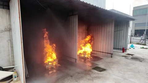 Sprinkler System Activating to Extinguish Fire in Training Exercise Stock Footage 301204159