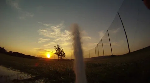  sprinkler working at sunset 動画素材 34240779