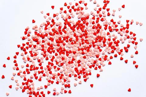 Sprinkles background, sugar sprinkle red hearts, decoration for cake and ba.. Stock Photos