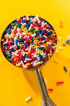 Sprinkles Close-Up on Yellow Table Stock Photos
