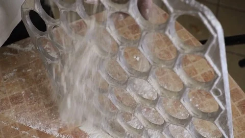 Sprinkles a flour dumpling mold from both sides 스톡 동영상 80044674