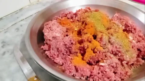 Sprinkling Aromatic Spices on Mutton Mince | Kebab Masala Preparation Video stock 313794234