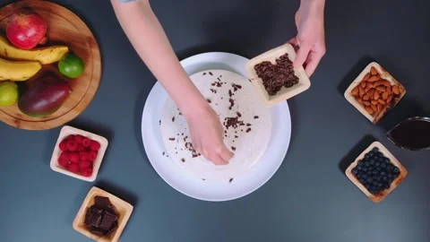 Sprinkling the cake with chopped chocolate Stock-Footage 252530988