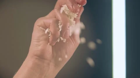 Sprinkling cheese with hand bottom view Stock Footage 158403398