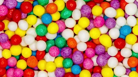 Sprinkling confectionery multi colored balls rotating, turning 스톡 동영상 242361914