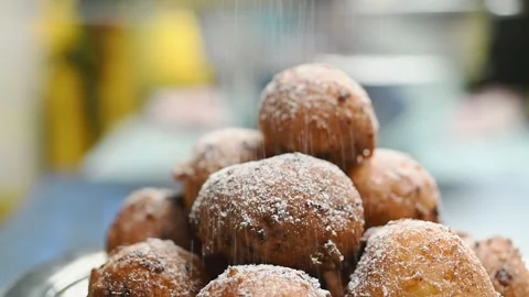 Sprinkling the donuts with powdered sugar. Stock Footage 209926708