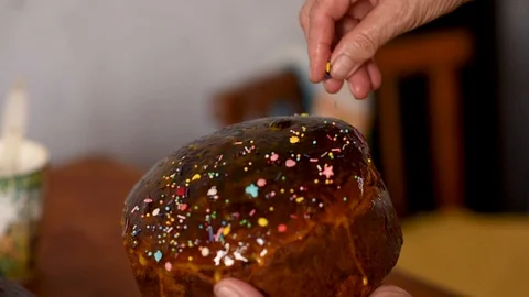 Sprinkling Easter bread with sweets Stock Footage 128545396
