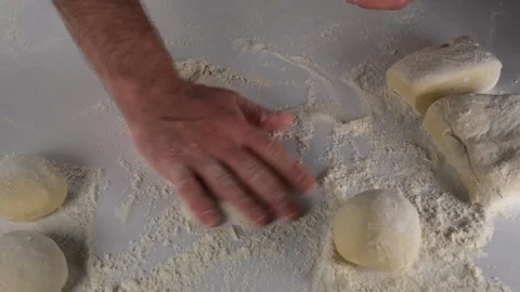 Sprinkling flour on the bench Stock Footage 228987823