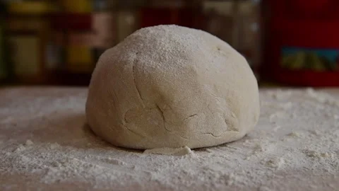 Sprinkling flour over dough. Stock Footage 149153672