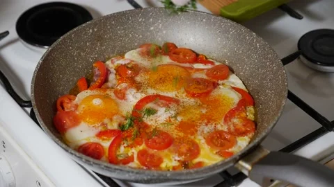 Sprinkling fried eggs Stock Footage 182792854