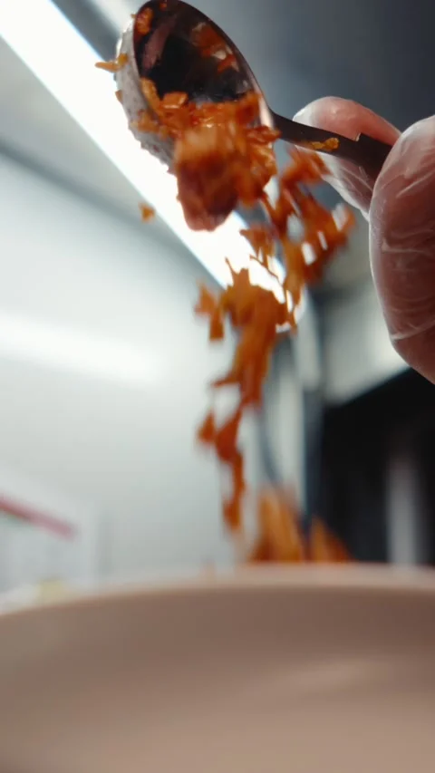 Sprinkling Fried Onion from Spoon Slow Motion Close up Stock Footage 342717385