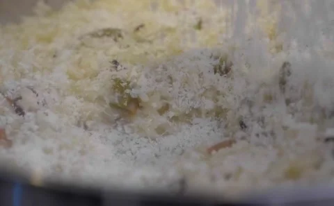 Sprinkling Grated Cheese On Risotto Rice Stock Footage 139233029