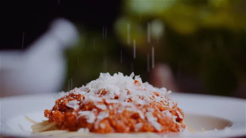 Sprinkling Parmesan on Pasta Stock Footage 304877146