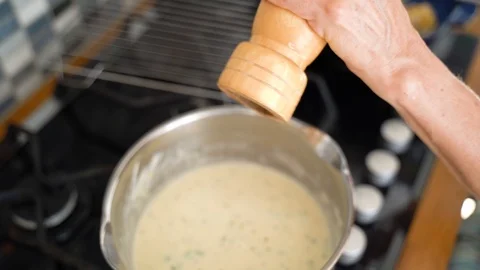 Sprinkling Pepper on Sauce Stock Footage 92904534