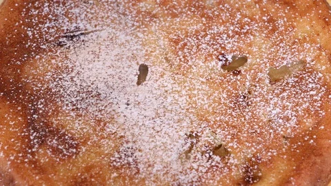 Sprinkling the pie with powdered sugar Stock Footage 128805297