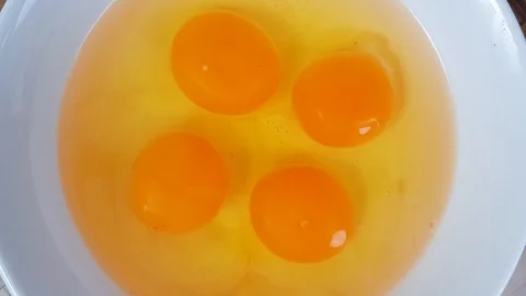 Sprinkling salt to the eggs Stock Footage 124108931