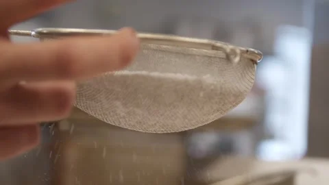 Sprinkling sugar into a muffin Stock Footage 307340014