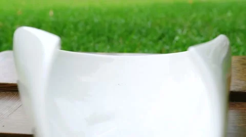 Sprinkling of tea into bowl Video stock 67994735