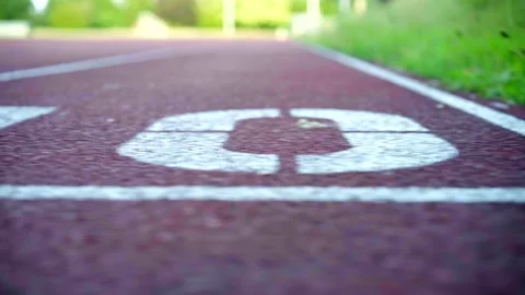 Sprint track start, smooth panning shot countdown from 10 to 1, in an Stock Footage 138053966