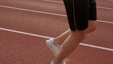 Sprinter in action running on a race track Stock-Footage 130168119