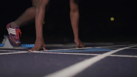 Sprinter Coming Out of Starting Blocks Video stock 208743382