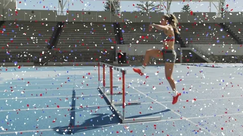 Sprinter entering jumping hurdle landing running on blue track training confetti Stock Footage 334311550