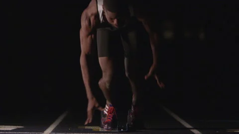 Sprinter Exploding Out of Starting Blocks Video stock 208743377