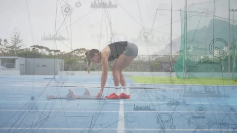Sprinter placing red blocks, adjusting, rising, preparing start while graphs Stock Footage 332685789