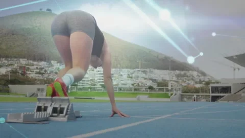 Sprinter pressing blocks, driving into sprint while sports tech nodes tracking Video stock 331045506