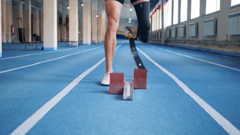 Sprinter with prosthesis stands on a start, close up. Stock Footage 101233410