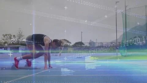 Sprinter pushing off blocks on blue track, driving right with binary overlays Stock Footage 331026082