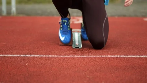 Sprinter in starting block getting ready for the run close up [6K50p] Stock-Footage 127114097