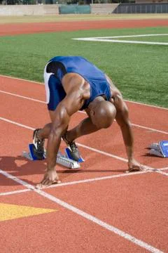 Sprinter At Starting Block Stock Photos
